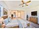 This main bedroom features ceiling fan, tv and dresser at 430 Pennsylvania Ave, Winter Garden, FL 34787