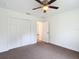 Bedroom features a ceiling fan and closet at 4790 Sw 166Th Loop, Ocala, FL 34473