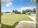 Lush front yard with green grass and view of neighboring homes in a residential area at 4790 Sw 166Th Loop, Ocala, FL 34473