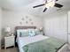 Bedroom with a bed, two bedside tables and a closet at 4820 Battaglia Blvd, St Cloud, FL 34769