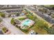 Aerial view of a lovely community pool and cabana surrounded by lush landscaping at 4820 Battaglia Blvd, St Cloud, FL 34769