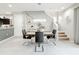 Well-lit dining room featuring modern chandelier, staircase, and easy access to the kitchen at 4820 Battaglia Blvd, St Cloud, FL 34769