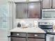 Close up of granite counters and stainless steel appliances in kitchen at 4820 Battaglia Blvd, St Cloud, FL 34769