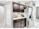 Kitchenette area includes dark wood cabinets, granite counters and stainless steel refrigerator at 4820 Battaglia Blvd, St Cloud, FL 34769