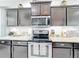 Close up of kitchen features stainless steel appliances and granite countertops at 4820 Battaglia Blvd, St Cloud, FL 34769