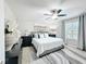 Serene main bedroom featuring a plush bed, soft lighting, and a neutral color palette for a restful retreat at 4820 Battaglia Blvd, St Cloud, FL 34769