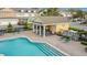 Poolside cabana with picnic table and chairs surrounded by lounge chairs and the community pool at 4820 Battaglia Blvd, St Cloud, FL 34769