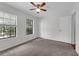 Carpeted bedroom with ceiling fan and lots of natural light at 486 Abba St, Altamonte Springs, FL 32714