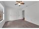 Cozy carpeted bedroom featuring a ceiling fan and closet at 486 Abba St, Altamonte Springs, FL 32714