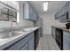 Well-lit kitchen with stainless steel refrigerator and stainless steel double sink at 486 Abba St, Altamonte Springs, FL 32714