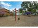 The neighborhood playground features a red swing set and climbing structure at 486 Abba St, Altamonte Springs, FL 32714