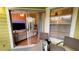 Outdoor patio with seating, accessible via sliding glass door from a well-lit living room at 5017 City St # 1932, Orlando, FL 32839