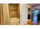 Bathtub and shower with neutral colored tile surround at 5017 City St # 1932, Orlando, FL 32839