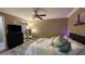 Comfortable bedroom featuring a ceiling fan, wood floors, and a plush rug at 5017 City St # 1932, Orlando, FL 32839