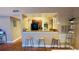 Modern kitchen with breakfast bar and adjacent laundry room at 5017 City St # 1932, Orlando, FL 32839