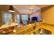 Spacious living room featuring a big screen tv, large sofa and vaulted ceiling at 5017 City St # 1932, Orlando, FL 32839