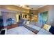 Spacious living room with modern furnishings, dining area, and access to outdoor seating at 5017 City St # 1932, Orlando, FL 32839