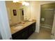 Bathroom featuring double sinks with granite countertops and a separate shower room at 510 Captiva Dr, Davenport, FL 33896