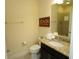 Bathroom featuring a toilet, granite countertop vanity, and a mirror with a 'Beach' sign on the wall at 510 Captiva Dr, Davenport, FL 33896