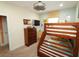 Charming ' bedroom with wood bunk beds and colorful surfboard decor at 510 Captiva Dr, Davenport, FL 33896