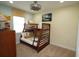 room with a bunk bed, ceiling fan, and fun, surf themed decorations at 510 Captiva Dr, Davenport, FL 33896