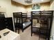 Fun ' bedroom with two sets of wooden bunk beds and animal-print decor at 510 Captiva Dr, Davenport, FL 33896