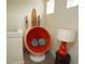 Fun sitting area with an orange pod chair, colorful decorations and nice lighting at 510 Captiva Dr, Davenport, FL 33896