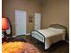 This bedroom has wood floors, two closets, and a black metal bed frame at 554 Pinebranch Cir, Winter Springs, FL 32708