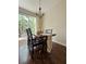 Light-filled dining area featuring wood table set and access to outdoor patio area at 554 Pinebranch Cir, Winter Springs, FL 32708