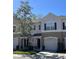 Charming townhome featuring a well-manicured lawn and attached one car garage at 554 Pinebranch Cir, Winter Springs, FL 32708