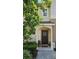 Beautiful front entryway featuring an inviting dark wood door with decorative wreath at 554 Pinebranch Cir, Winter Springs, FL 32708