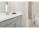 Bathroom featuring a modern vanity, faucet, a clear shower and toilet at 565 Big Pine Ave, Minneola, FL 34715