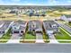 Exterior aerial view of a two-story home, showcasing its landscaping and surrounding neighborhood at 565 Big Pine Ave, Minneola, FL 34715