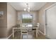 Cozy dining room with natural light, a modern chandelier and wall decorations at 620 Wexford Ct, Winter Haven, FL 33884