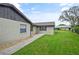 Cozy home exterior featuring well-kept lawn and a walkway leading to the entrance at 620 Wexford Ct, Winter Haven, FL 33884