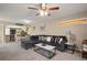 Inviting living room with a sectional sofa, accent pillows, and a view of the kitchen at 620 Wexford Ct, Winter Haven, FL 33884