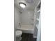 Clean bathroom with a white shower and a matching toilet and tiled floors at 631 Grenadine Ct # 631, Winter Park, FL 32792