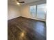 Bedroom with hardwood floors, fan, and window that provides natural light at 631 Grenadine Ct # 631, Winter Park, FL 32792