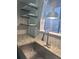 Modern kitchen sink with granite countertops, open shelving, and stainless steel faucet at 631 Grenadine Ct # 631, Winter Park, FL 32792