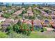 Aerial view of a lovely residential neighborhood featuring a pool, lush trees and landscaping at 6992 Brescia Way, Orlando, FL 32819