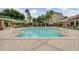 Beautiful community pool featuring lounge chairs and a covered seating area at 6992 Brescia Way, Orlando, FL 32819