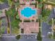 An aerial view of the community pool featuring palm trees and outdoor seating at 6992 Brescia Way, Orlando, FL 32819