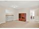 Carpeted loft featuring a wooden cabinet and view into another room with neutral walls and plenty of light at 6992 Brescia Way, Orlando, FL 32819