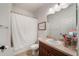 Bathroom featuring a shower with a white curtain, toilet, vanity, and wall mirror at 707 Brandy Oaks Loop, Winter Garden, FL 34787