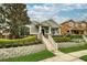Charming single-story home with manicured lawn and stone accents, showcasing curb appeal and inviting entrance at 707 Brandy Oaks Loop, Winter Garden, FL 34787