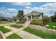 Charming home with landscaped front yard, well-maintained lawn, and inviting entrance at 707 Brandy Oaks Loop, Winter Garden, FL 34787