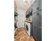 Well-organized laundry room with custom cabinets, brick floors, and modern appliances at 707 Brandy Oaks Loop, Winter Garden, FL 34787