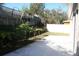 Large concrete patio with partial privacy fence at 7756 Beridale Ct, Orlando, FL 32818