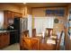 Functional kitchen with stainless steel appliances, wood cabinetry, and an adjacent dining area for easy meals at 7756 Beridale Ct, Orlando, FL 32818