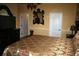 A main bedroom showcases a decorative mirror, television on a dresser, and two entryways at 7756 Beridale Ct, Orlando, FL 32818